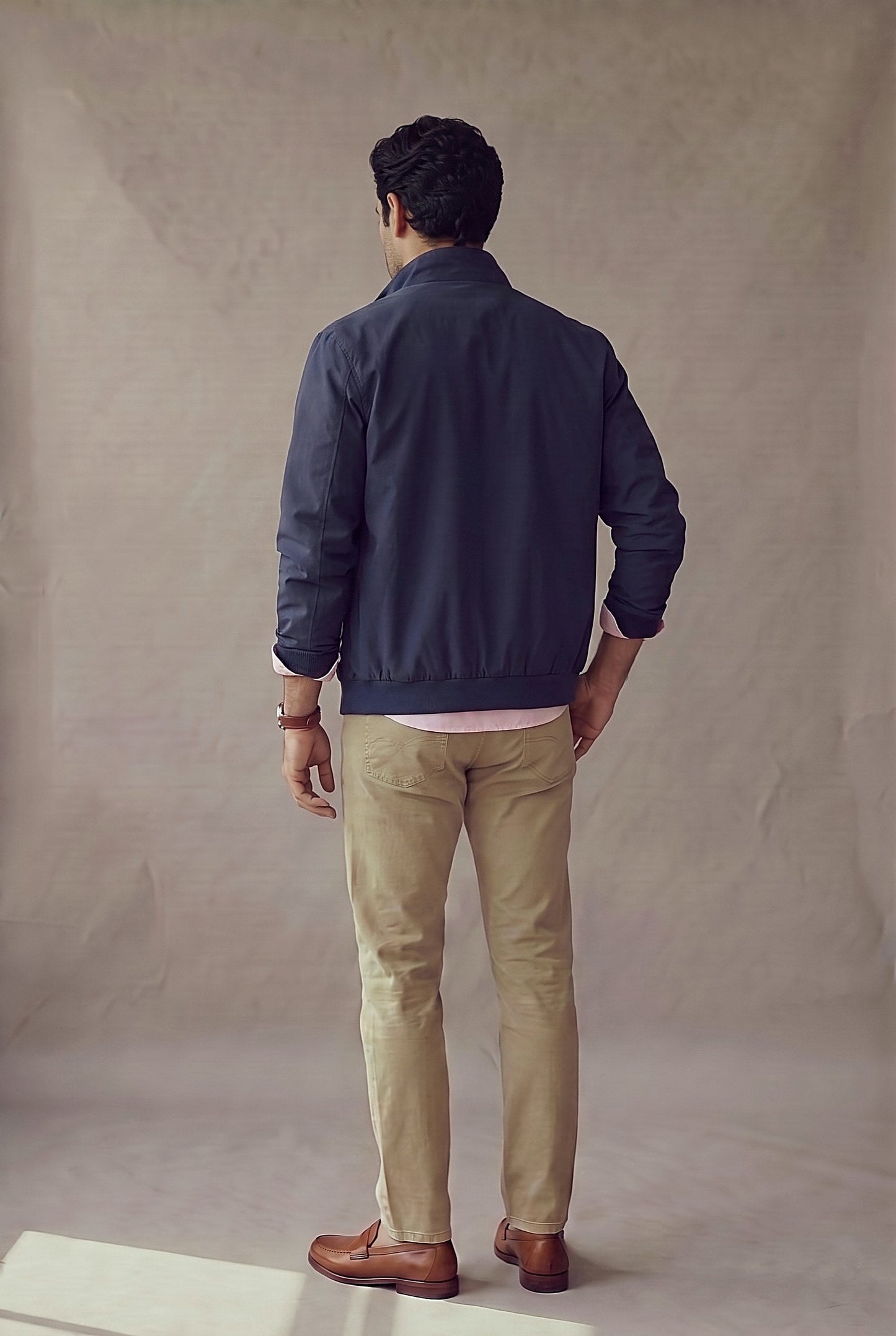 Chaqueta Harrington azul marino para hombre en vista de espalda, de Luck & Load.